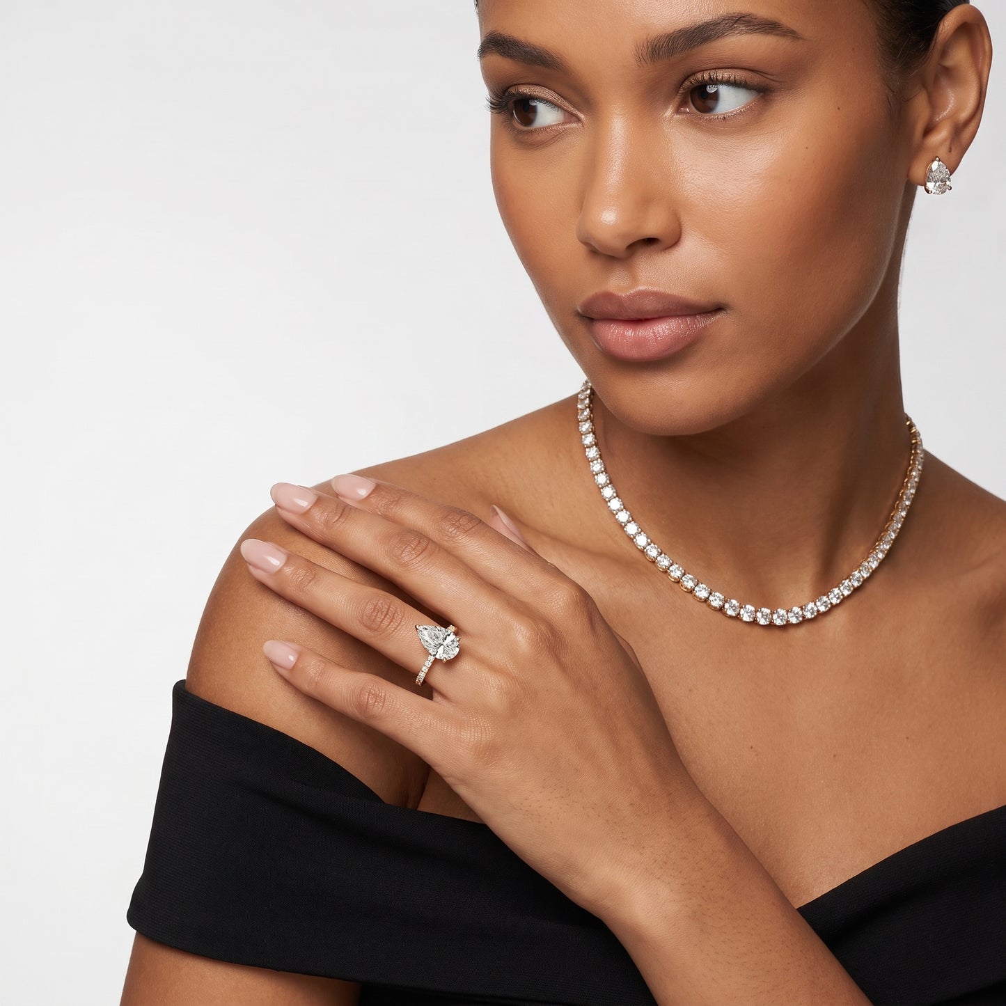 Novara Solitaire Pavé Pear Diamond Ring in Yellow Gold - model.jpg
