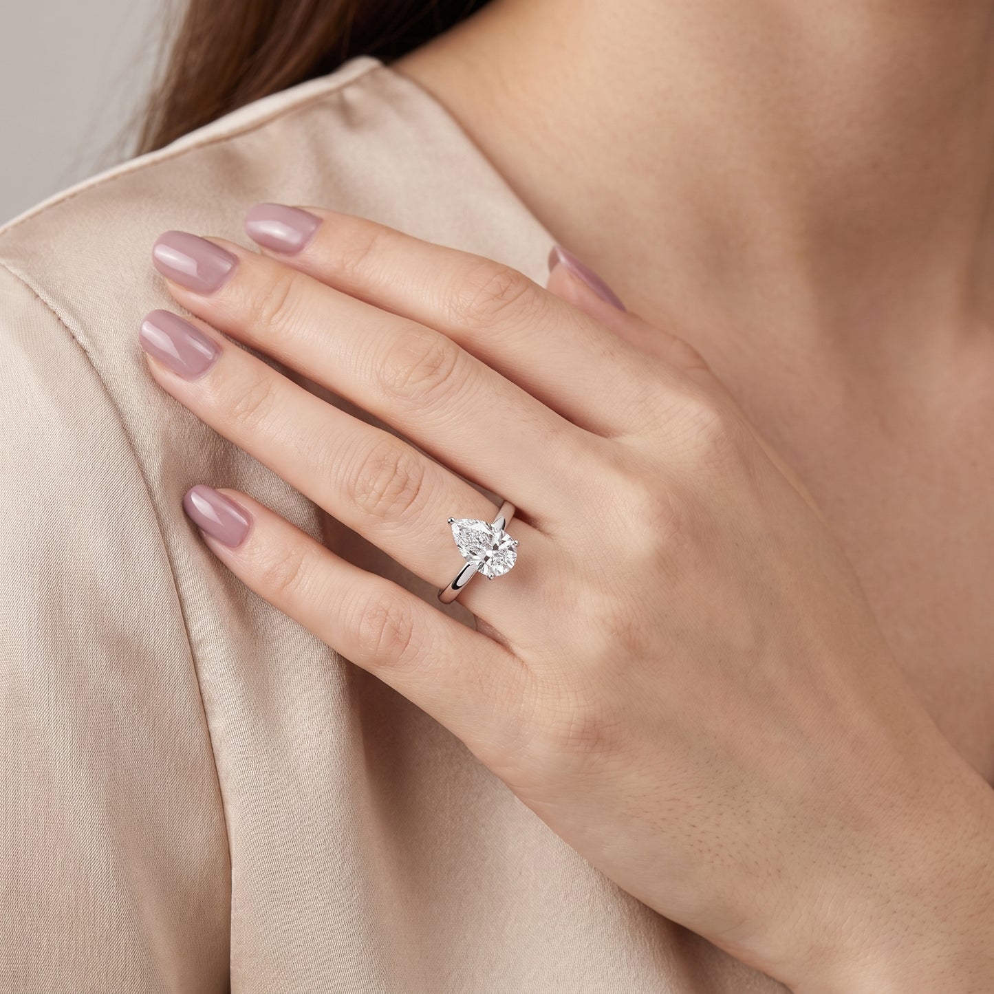 Delia Solitaire Pear Diamond Engagement Ring in Platinum - model.jpg