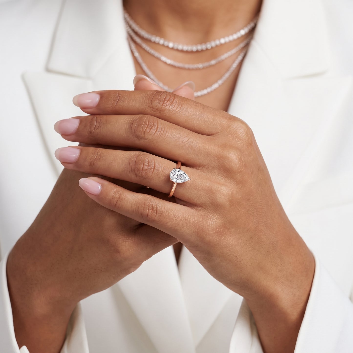 Kalia Knife Edge Solitaire Pear Diamond Engagement Ring in Rose Gold - model.jpg