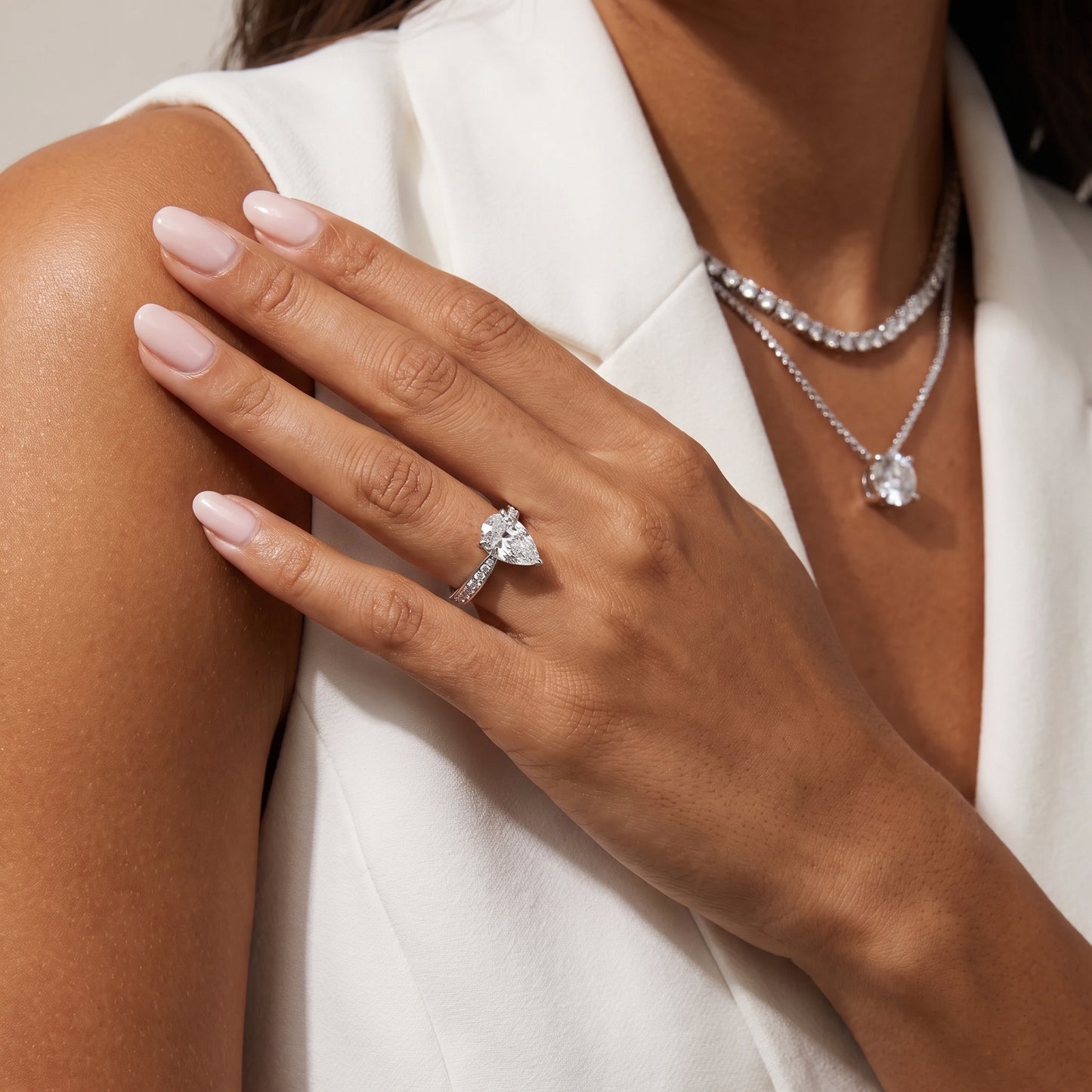 Rhea Sidestone Pavé Pear Diamond Engagement Ring in White Gold - model.jpg