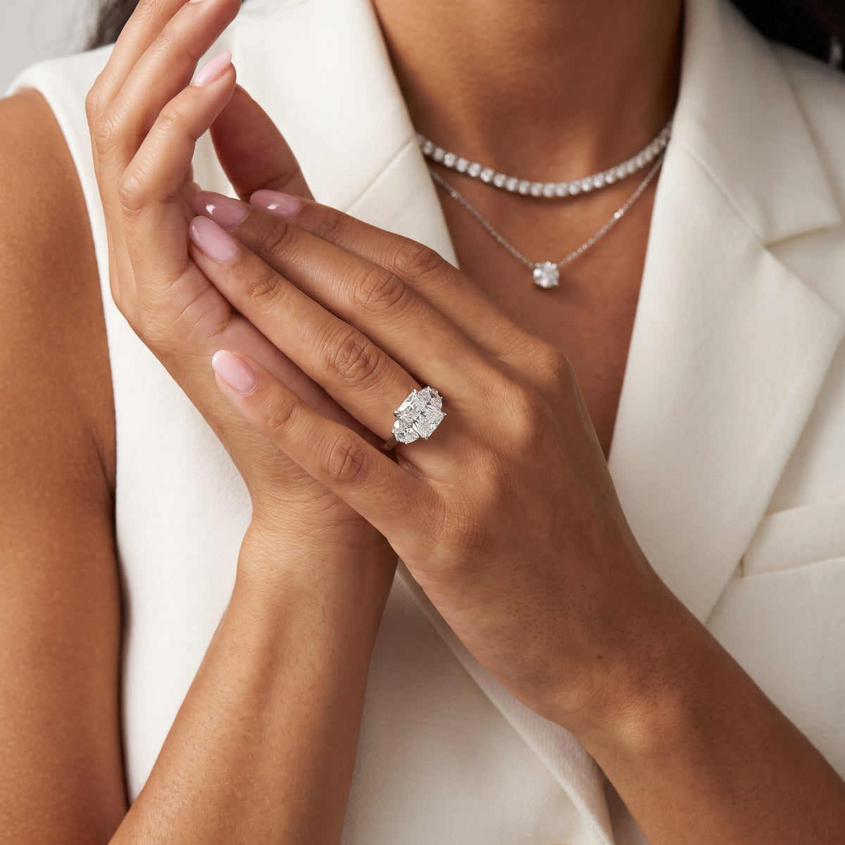 Romy Three-Stone Radiant Diamond Engagement Ring in Platinum - model.jpg