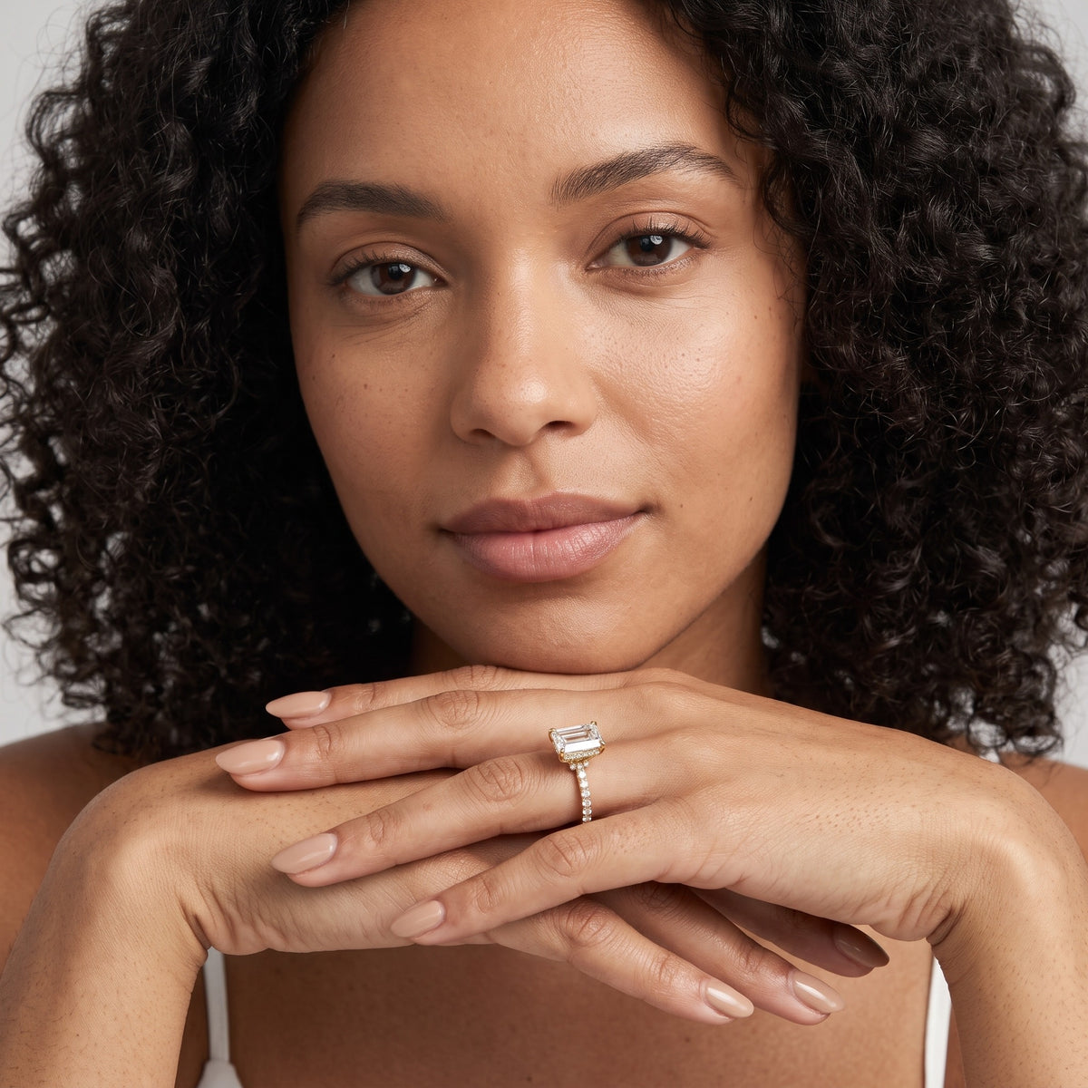 Nessa Hidden Halo Pavé Emerald Diamond Engagement Ring in Platinum - model.jpg