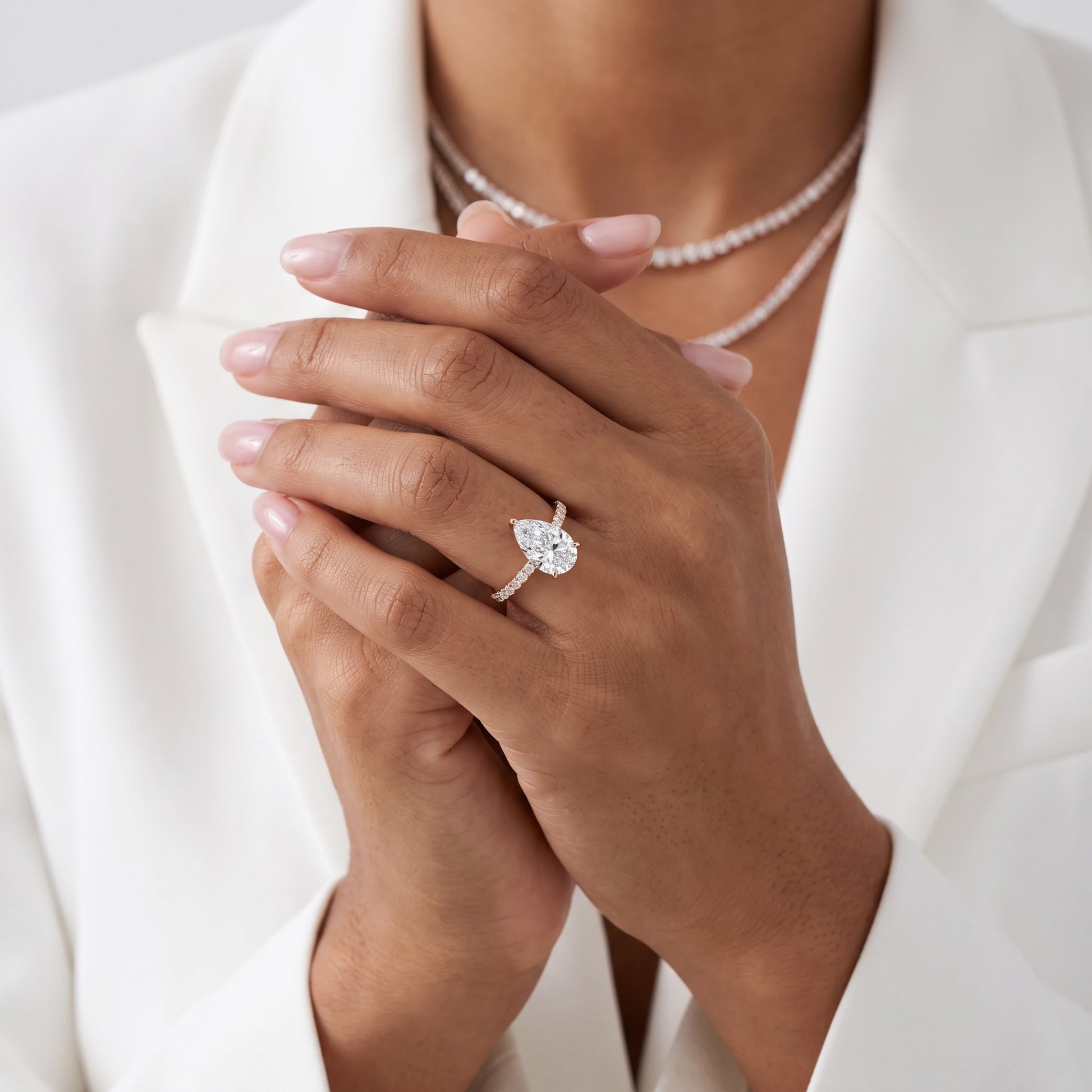 Novara Solitaire Pavé Pear Diamond Ring in Rose Gold - model.jpg