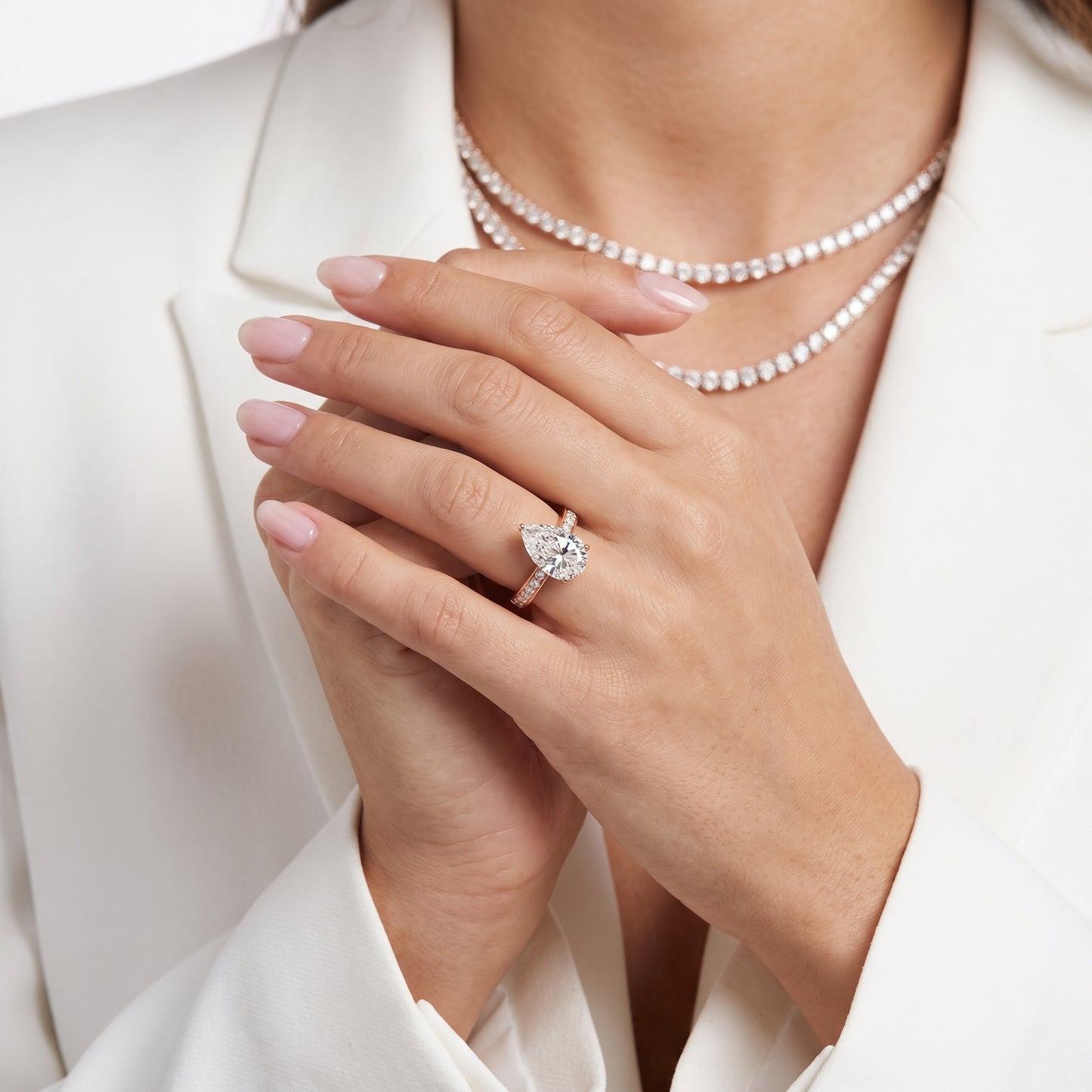 Rhea Sidestone Pavé Pear Diamond Engagement Ring in Rose Gold - model.jpg