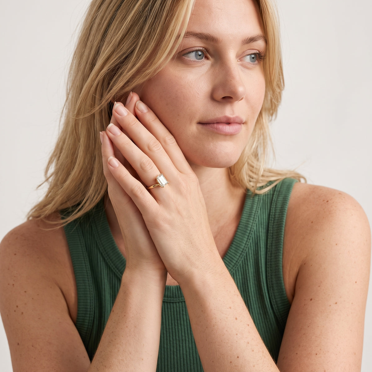 Clio Bypass Solitaire Emerald Diamond Engagement Ring in Rose Gold - model.jpg