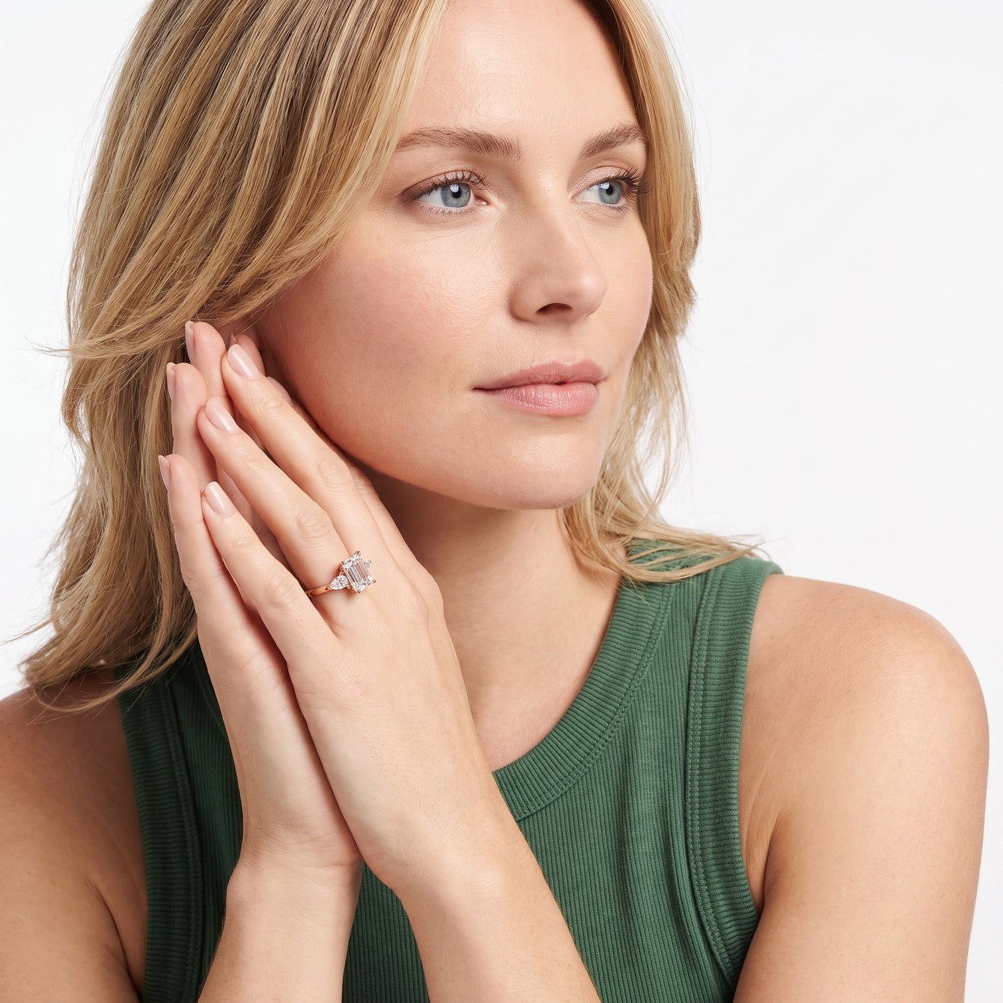 Leila Three-Stone Emerald Diamond Engagement Ring in Rose Gold - model.jpg