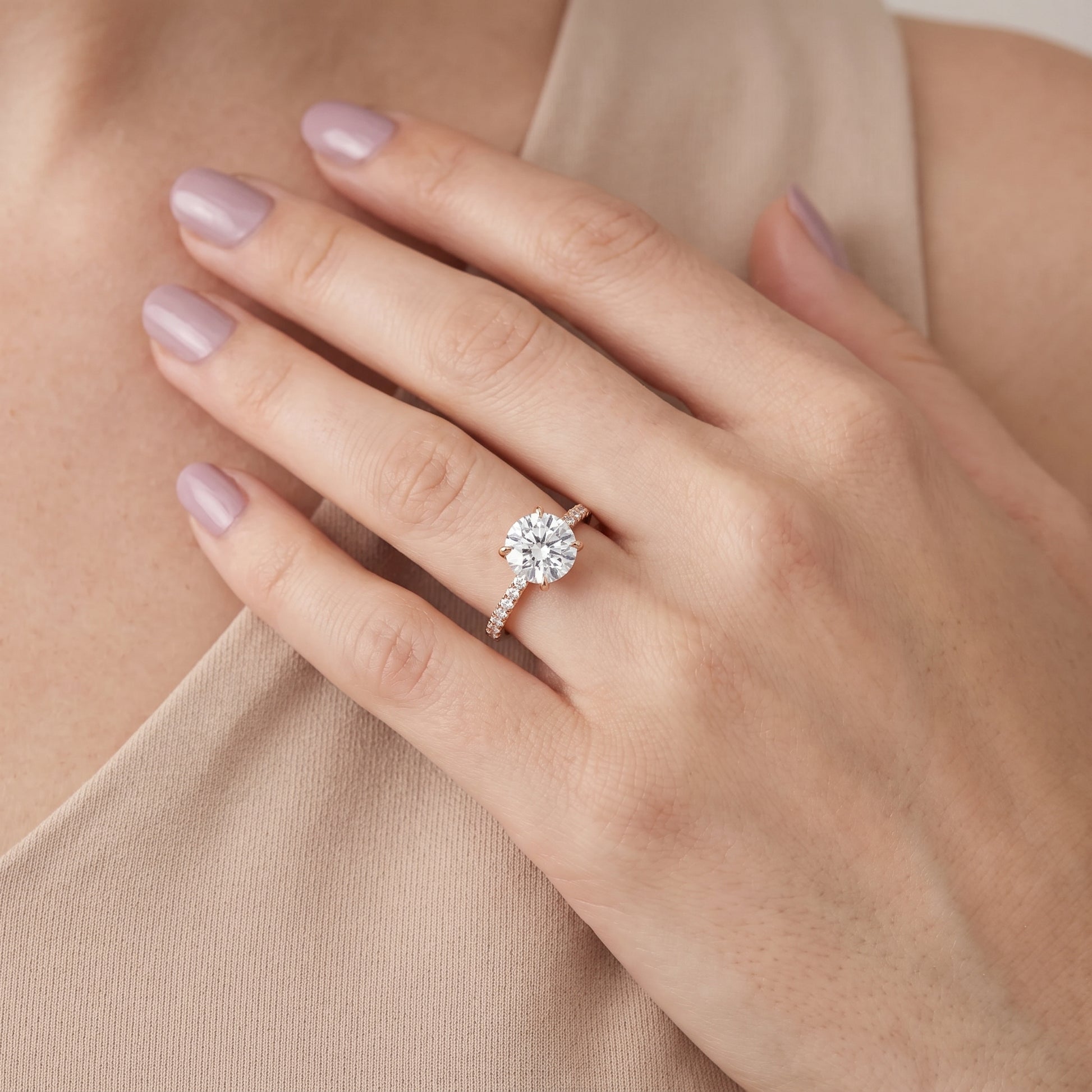 Ione Solitaire Pavé Round Diamond Engagement Ring in Rose Gold - model.jpg