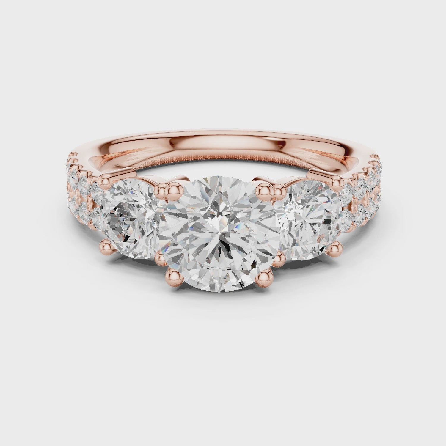 Celeste Three-Stone Round Diamond Engagement Ring in Rose Gold
