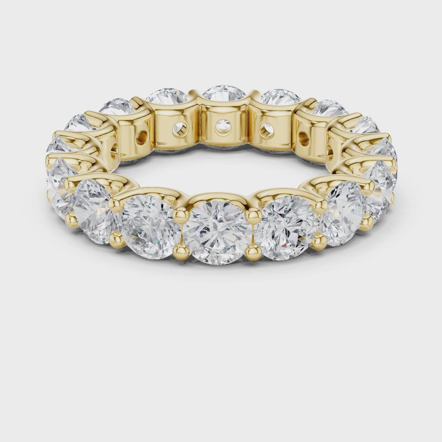 Warm Brilliance Round Diamond Eternity Band in Yellow Gold