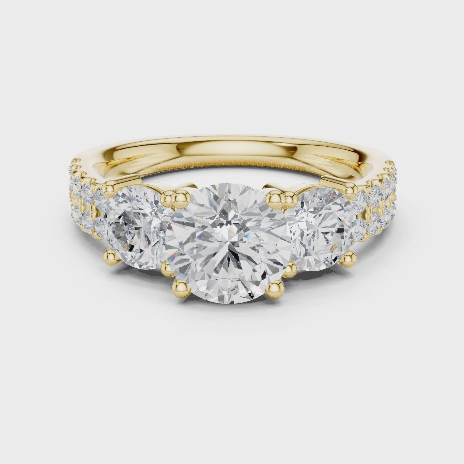 Celeste Three-Stone Round Diamond Engagement Ring in Yellow Gold