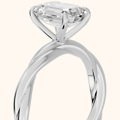 Nicola Twist Solitaire Emerald Diamond Engagement Ring in Silver - slant-view.webp