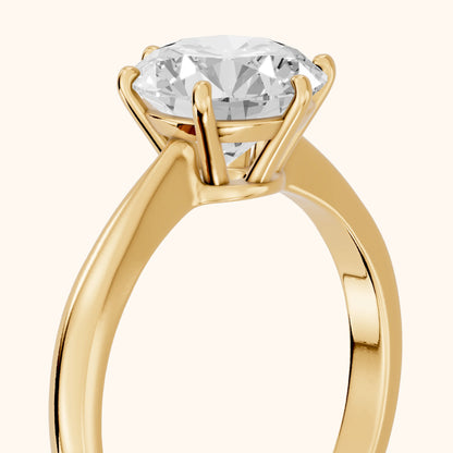 Skye Basket Solitaire Round Diamond Engagement Ring in Yellow Gold - slant-view.webp