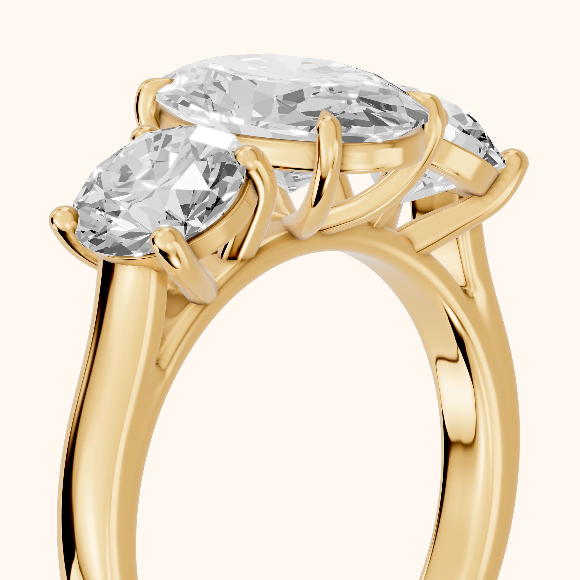 Esme Three-Stone Tapered Oval Diamond Ring in Yellow Gold - slant-view.webp