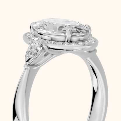 Eliza Halo Sidestone Oval Diamond Engagement Ring in Platinum - slant-view.webp