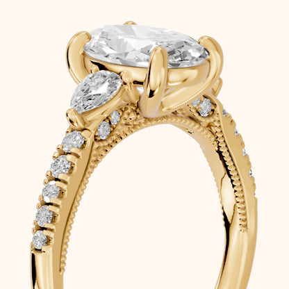 Weston Pear-Side Three-Stone Oval Diamond Engagement Ring in Yellow Gold - slant-view.webp