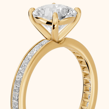 Brielle Channel Set Solitaire Cushion Diamond Ring in Yellow Gold - slant-view.webp