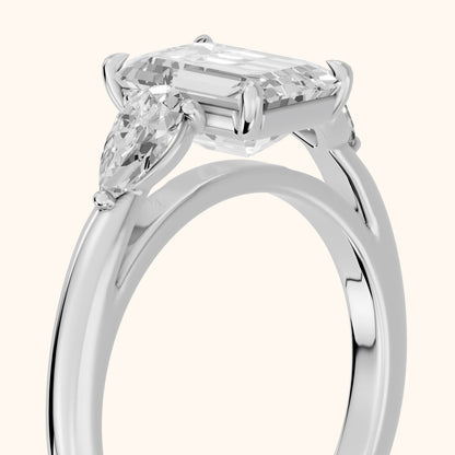 Phoebe Three-Stone Emerald Diamond Ring in White Gold - slant-view.webp