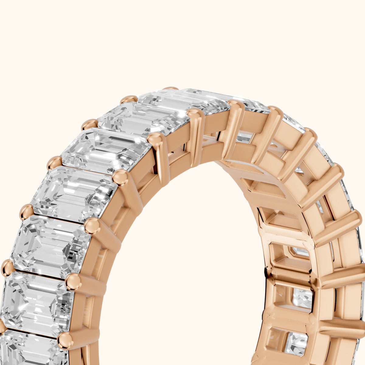 Callia Shared Prong Emerald Diamond Eternity Band in Rose Gold - slant-view