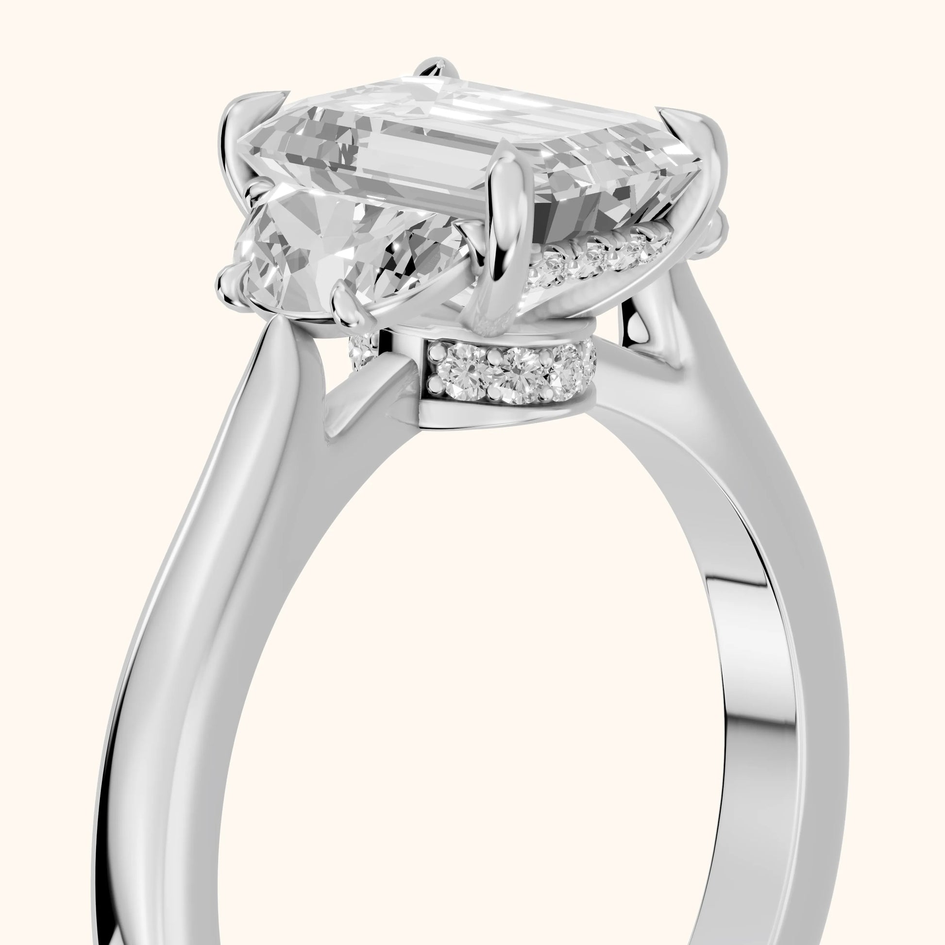 Romy Three-Stone Emerald Diamond Engagement Ring in Platinum - slant-view.webp