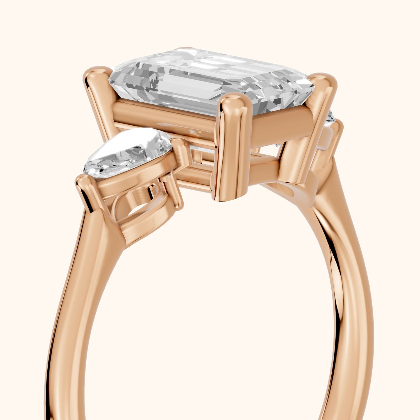 Faye Three-Stone Trellis Emerald Diamond Ring in Rose Gold - slant-view.webp