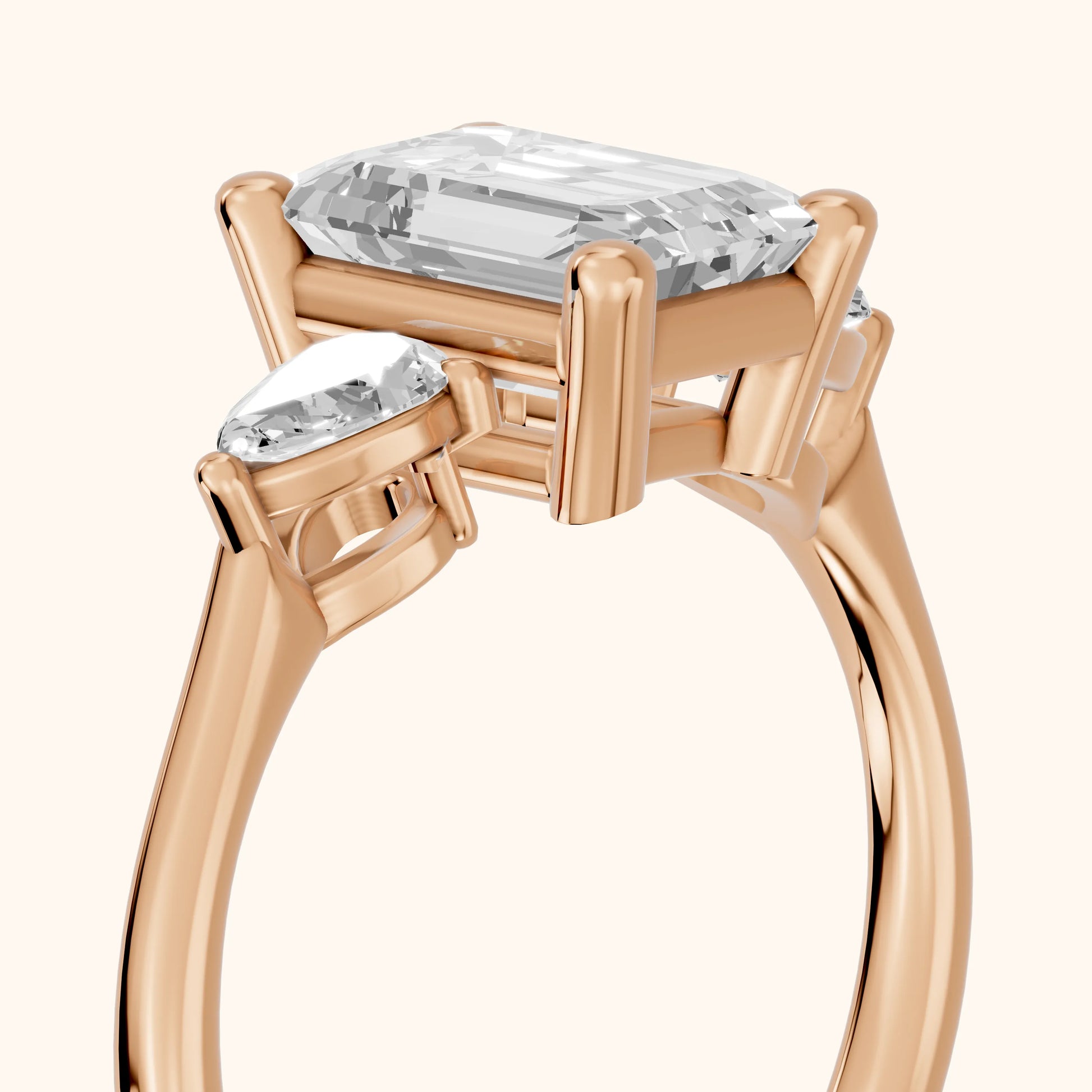 Faye Three-Stone Trellis Emerald Diamond Ring in Rose Gold - slant-view.webp
