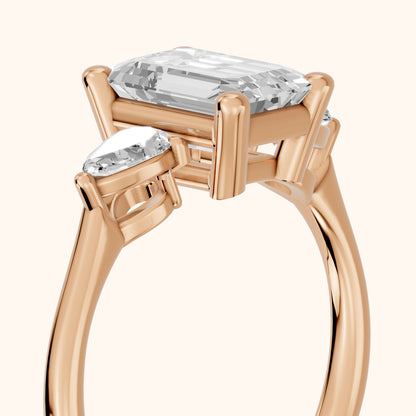 Faye Three-Stone Trellis Emerald Diamond Ring in Rose Gold - slant-view.webp