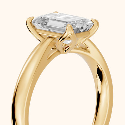 Lucia Solitaire Six-Prong Emerald Diamond Engagement Ring in Yellow Gold - slant-view.webp
