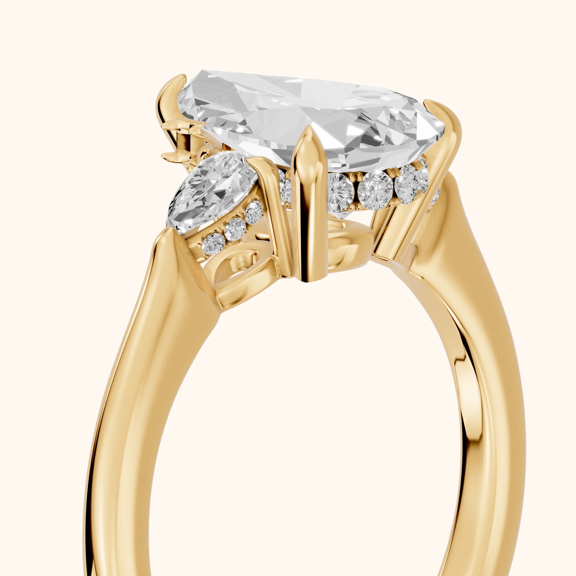 Leila Three-Stone Pear Diamond Engagement Ring in Yellow Gold - slant-view.webp