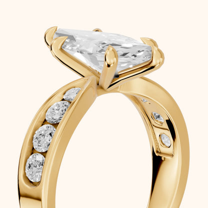 Noor Channel Set Sidestone Marquise Diamond Engagement Ring in Yellow Gold - slant-view.webp