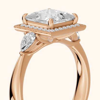 Eliza Halo Sidestone Princess Diamond Engagement Ring in Rose Gold - slant-view.webp