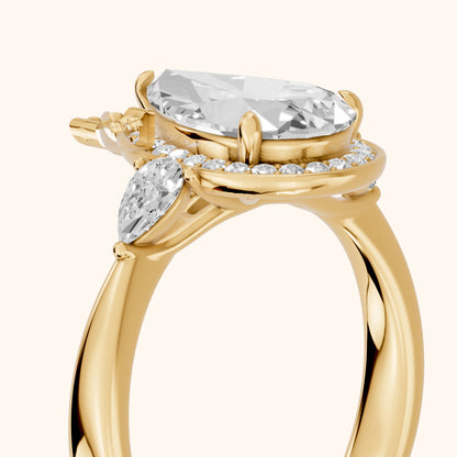 Eliza Halo Sidestone Pear Diamond Engagement Ring in Yellow Gold - slant-view.webp