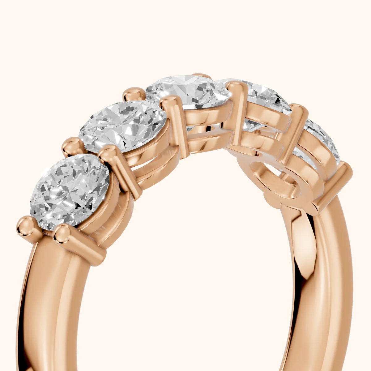 Theia Shared Prong Round Diamond Wedding Band in Rose Gold - slant-view