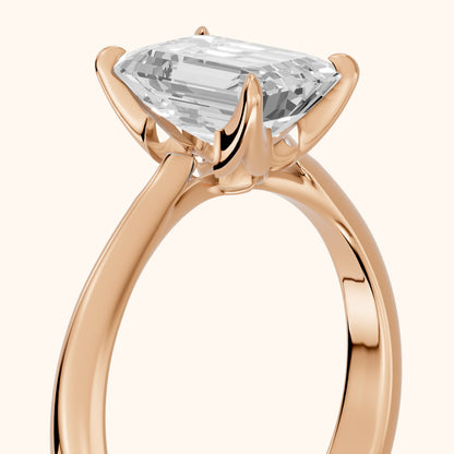 Evie Solitaire Six-Prong Emerald Diamond Engagement Ring in Rose Gold - slant-view.webp