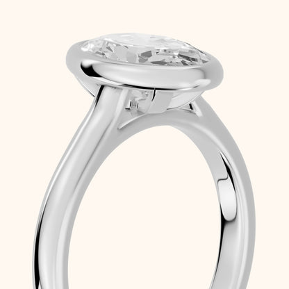 Jolie Bezel Solitaire Oval Diamond Engagement Ring in White Gold - slant-view.webp