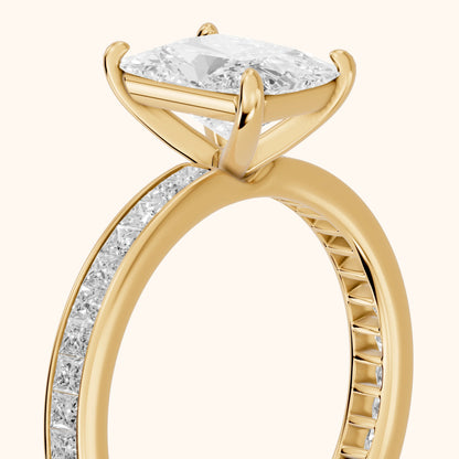 Brielle Channel Set Solitaire Radiant Diamond Engagement Ring in Yellow Gold - slant-view.webp