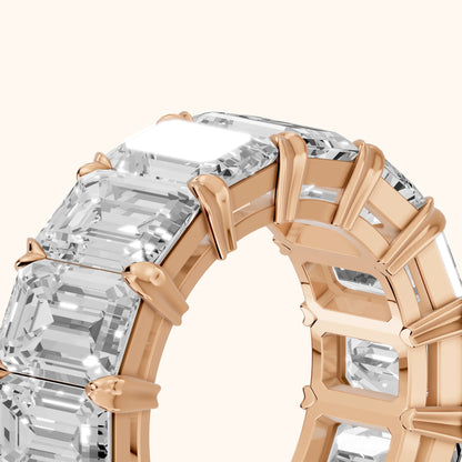 Odessa Shared Prong Emerald Diamond Eternity Band in Rose Gold - slant-view