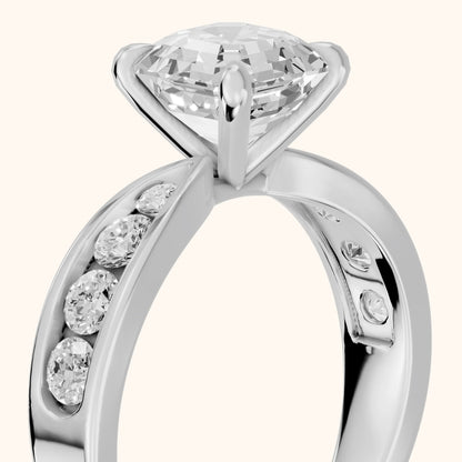 Noor Channel Set Sidestone Asscher Diamond Engagement Ring in Platinum - slant-view.webp