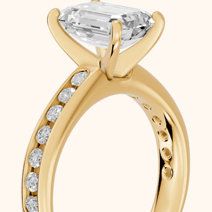 Avalon Channel Set Emerald Diamond Engagement Ring in Yellow Gold - slant-view.webp
