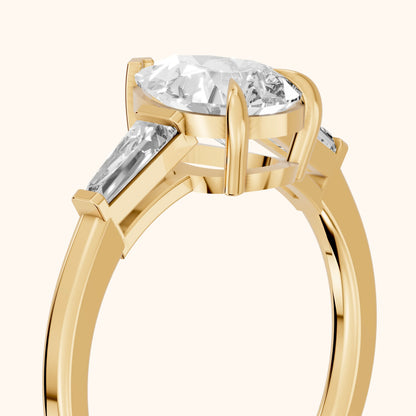 Winnie Three-Stone Pear Diamond Engagement Ring in Yellow Gold - slant-view.webp