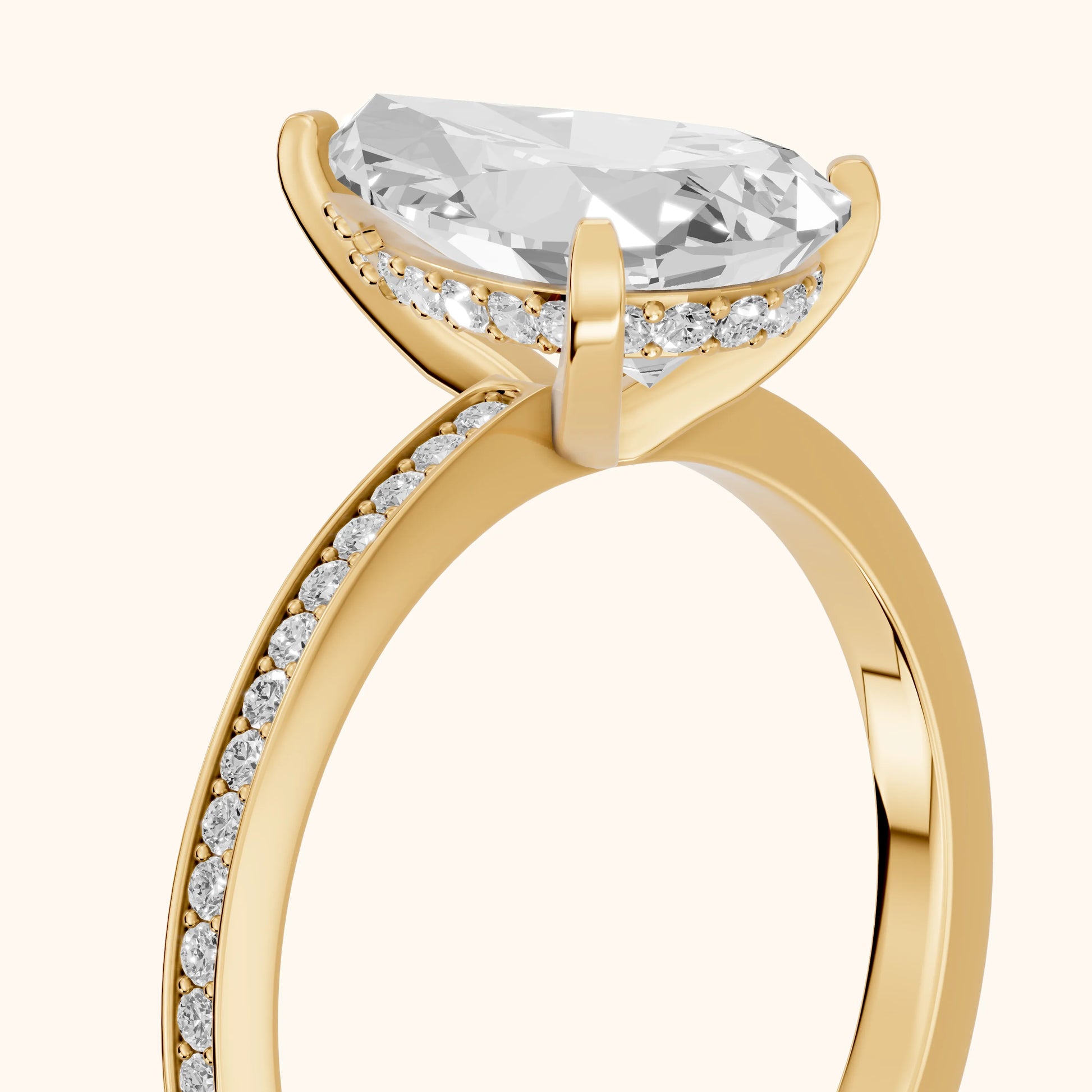 Naia Hidden Halo Pear Diamond Ring in Yellow Gold - slant-view.webp