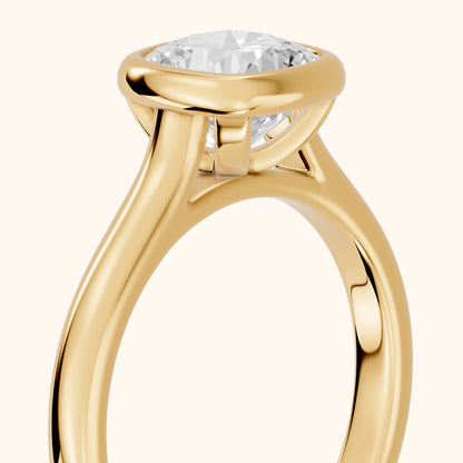 Jolie Bezel Solitaire Cushion Diamond Engagement Ring in Yellow Gold - slant-view.webp