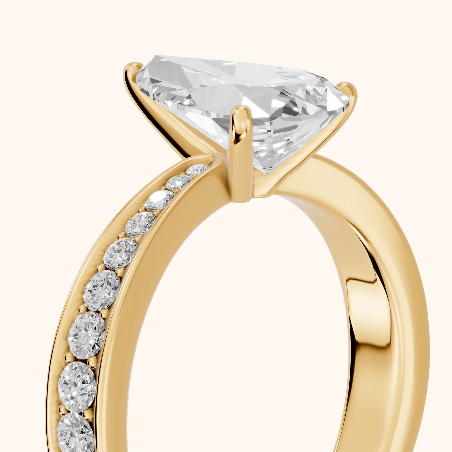 Rhea Sidestone Pavé Pear Diamond Engagement Ring in Yellow Gold - slant-view.webp
