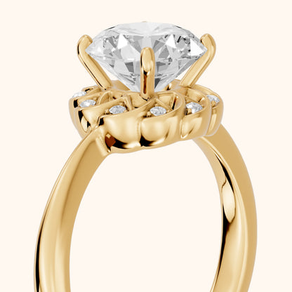 Trudy Floral Halo Round Diamond Engagement Ring in Yellow Gold - slant-view.webp