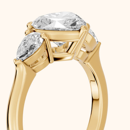 Mirabel Three-Stone Heart Diamond Engagement Ring in Yellow Gold - slant-view.webp