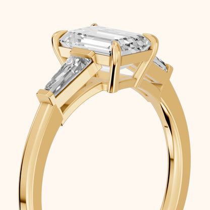 Winnie Three-Stone Emerald Diamond Engagement Ring in Yellow Gold - slant-view.webp