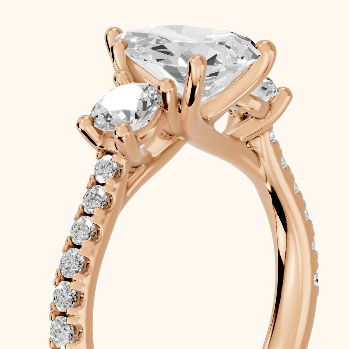 Sibyl Trellis Three-Stone Pear Diamond Engagement Ring in Rose Gold - slant-view.webp