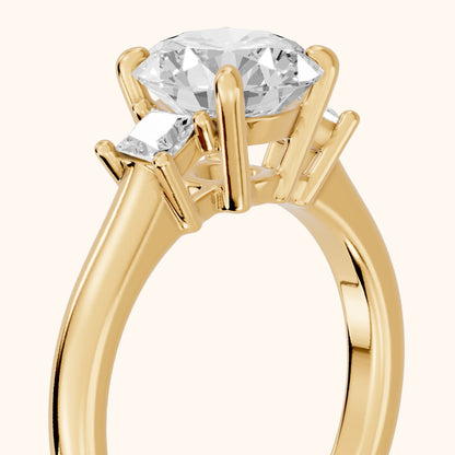 Brenna Three-Stone Round Diamond Engagement Ring in Yellow Gold - slant-view.webp
