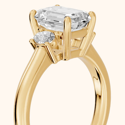 Alya Three-Stone Cathedral Emerald Diamond Engagement Ring in Yellow Gold - slant-view.webp