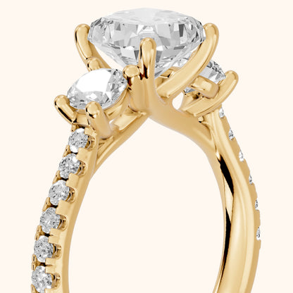 Sibyl Trellis Three-Stone Cushion Diamond Engagement Ring in Yellow Gold - slant-view.webp