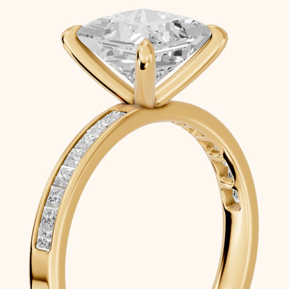 Maren Sidestone Channel Set Princess Diamond Engagement Ring in Yellow Gold - slant-view.webp